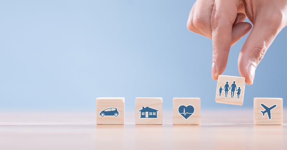 family, travel, life insurance policy, wooden blocks, MundoNOW