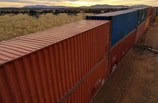 Two shipping containers collapsed