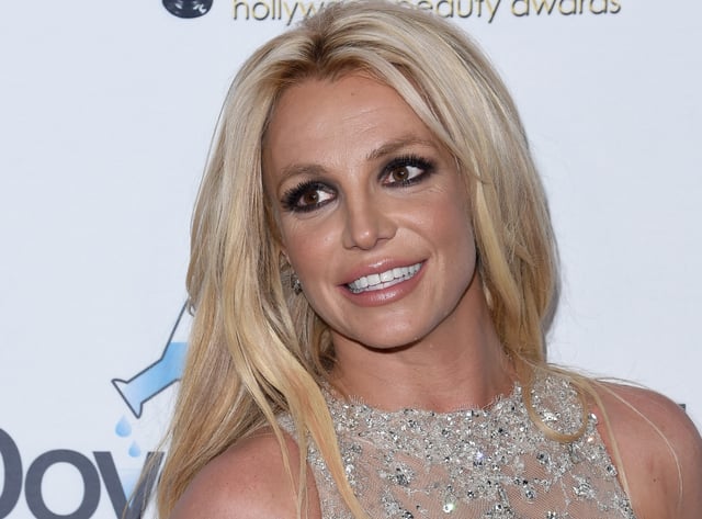 Britney Spears lets loose at her wedding reception and recreates her iconic kiss with Madonna