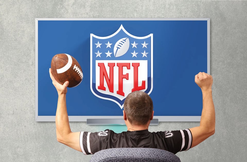 Fan of american football. Man watching broadcast NFL on TV