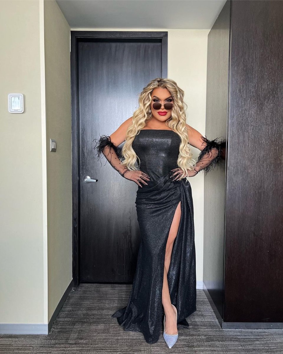 Wendy Guevara, trans, woman, gray dress, pose