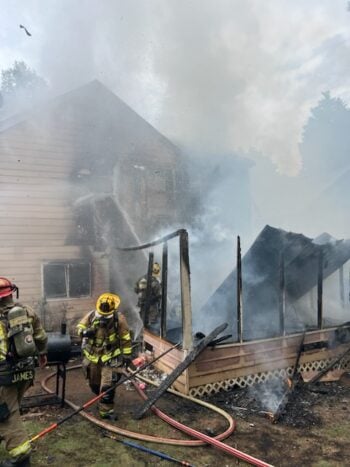 Finding himself surrounded, he sets his apartment on fire.