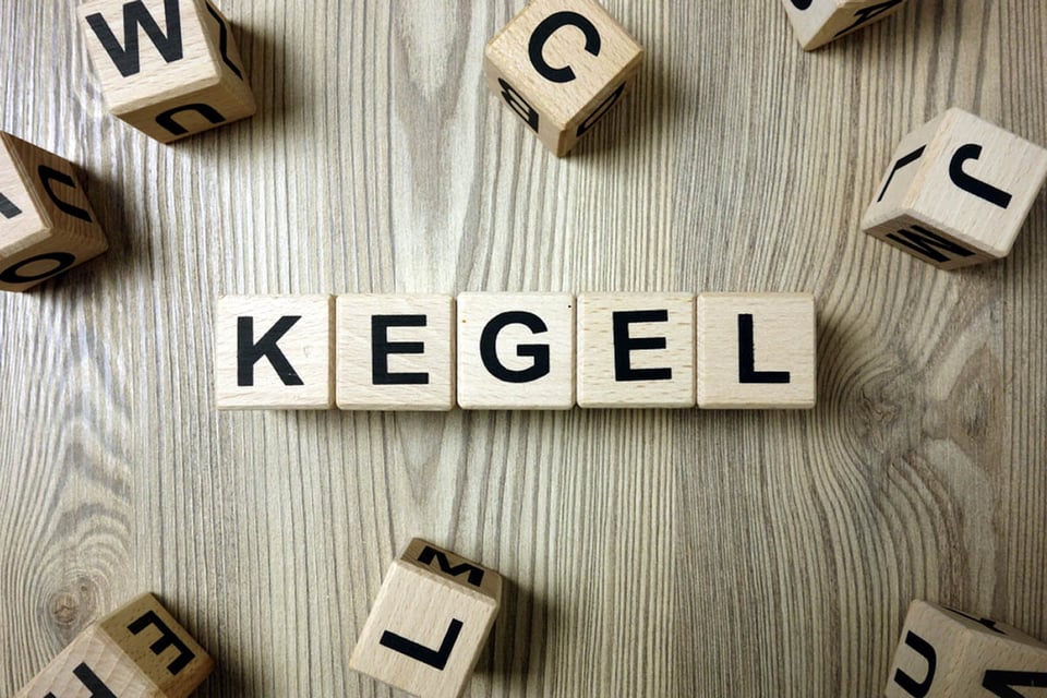 Word kegel from wooden blocks on desk