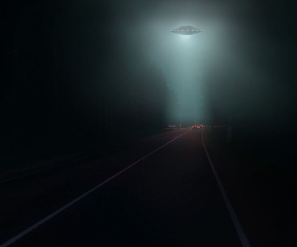 UFO flying over a highroad