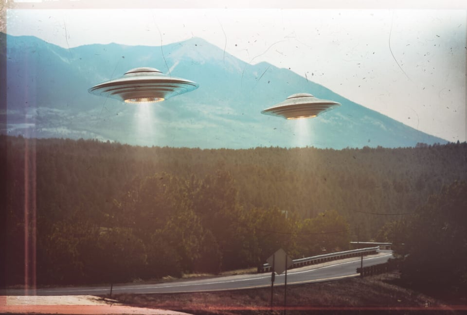 Two UFOs flying over highroad