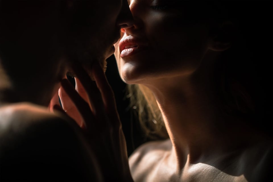 A couple about to kiss with passion