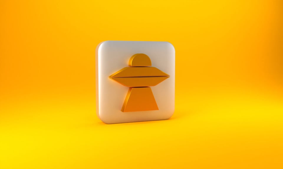 Icono de OVNI color dorado