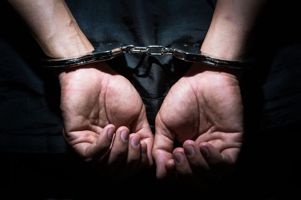 Hands of man with handcuffs