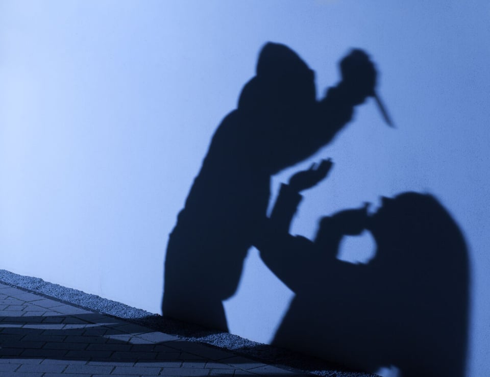 Shadows of a man and victim representing an idea of the Denver Killer