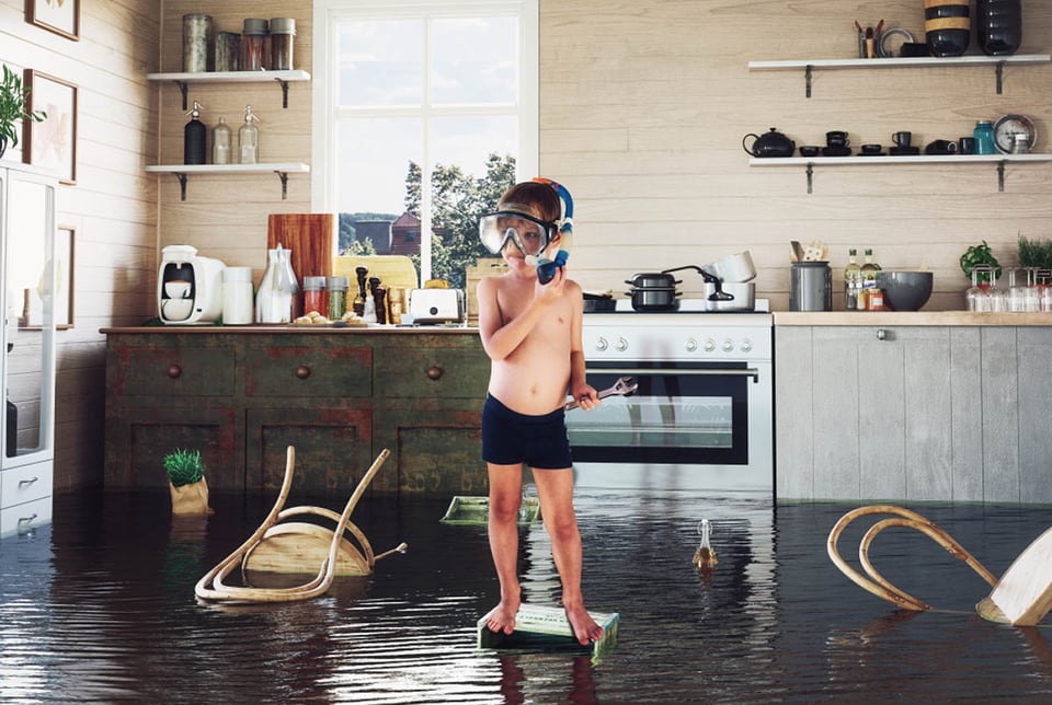 kids play on the table while flooding in the kitchen