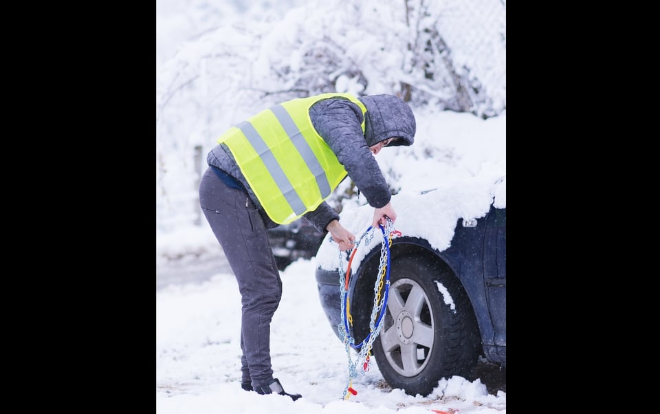 winter tires, tires, chains on the rim, snowfall, fluorescent vest 