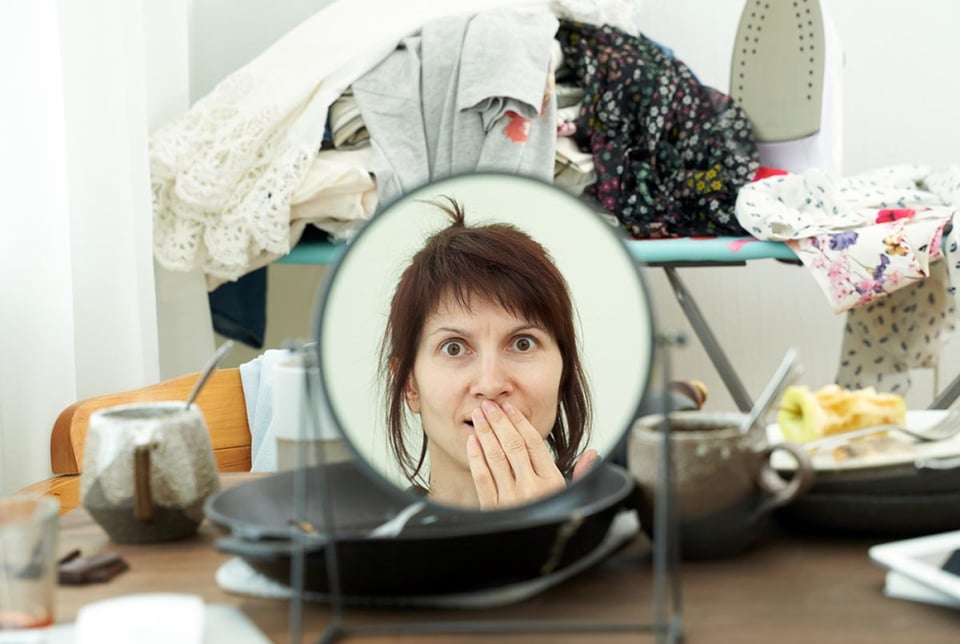 Woman, mirror, dirty dishes, chaos, clutter