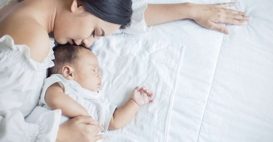 A girl resting with her son