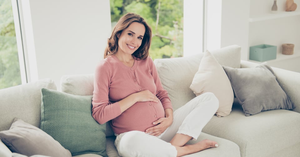 A pregnant woman sitting