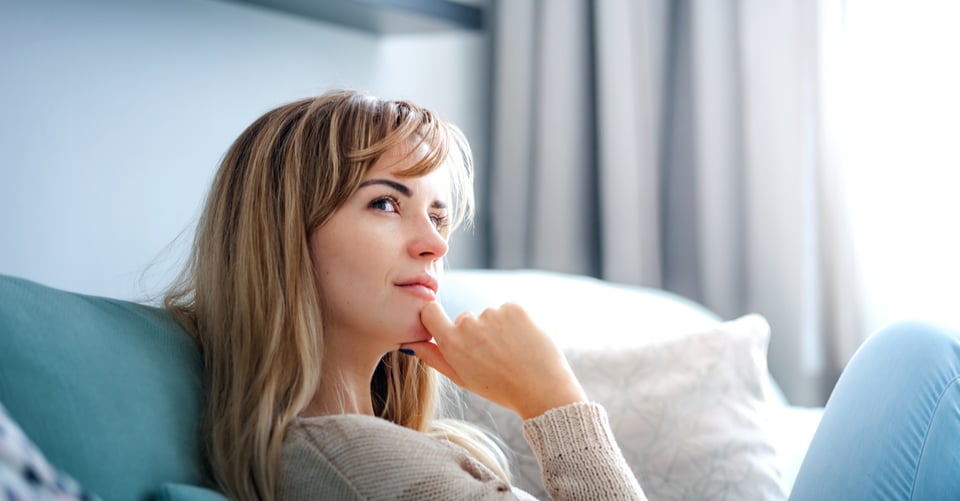 A woman thinking about her professional skills