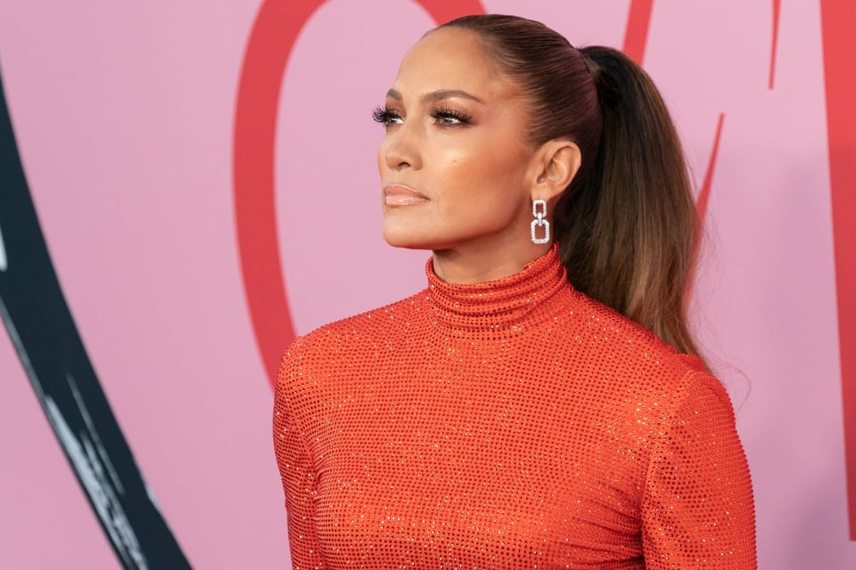 JLo stuns in a sexy swimsuit promoting her Delola cocktails but people call her an opportunist