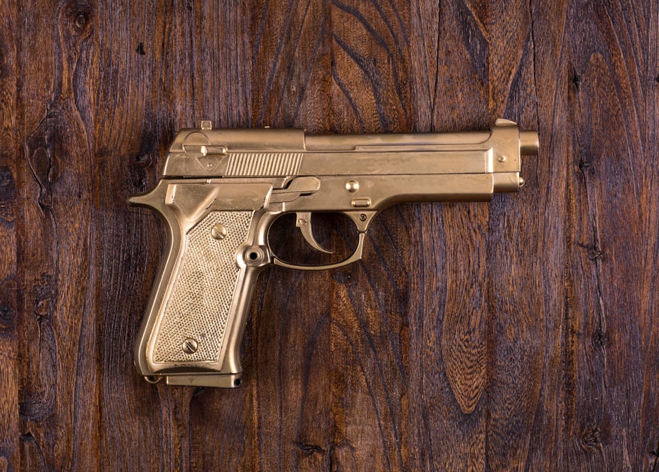 The gold-plated pistol was a gift to all his children.
