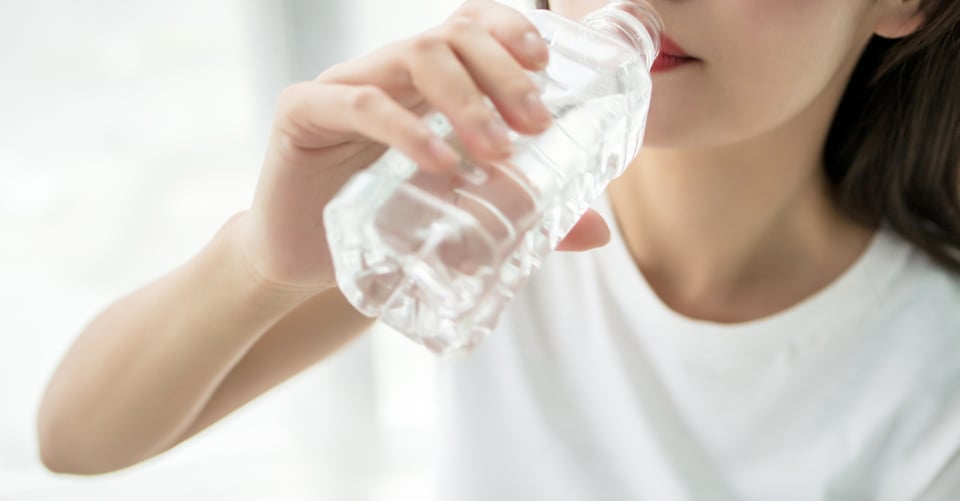 Person with bottle of water