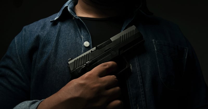 A killer with a gun in his hand
