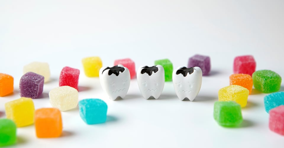 Sweets along with decayed teeth