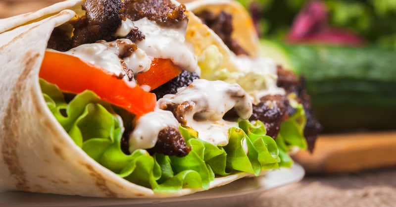 A photo of a burrito that came in frozen food packaging