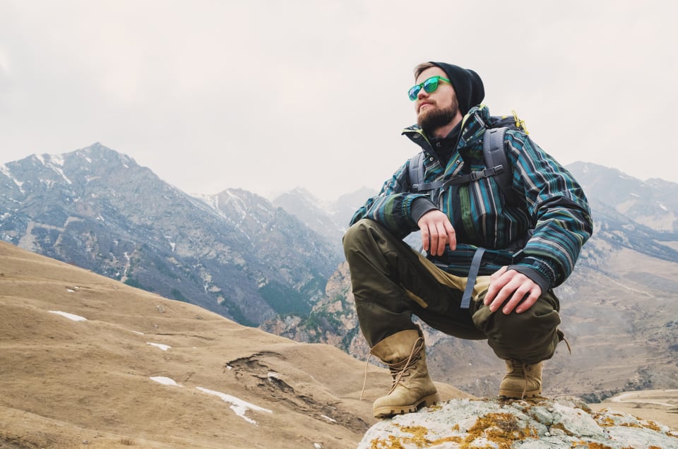 Man on top of a mountain