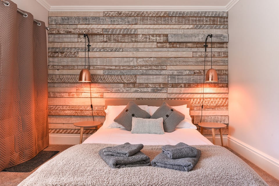 Modern Bedroom with rustic wooden headboard