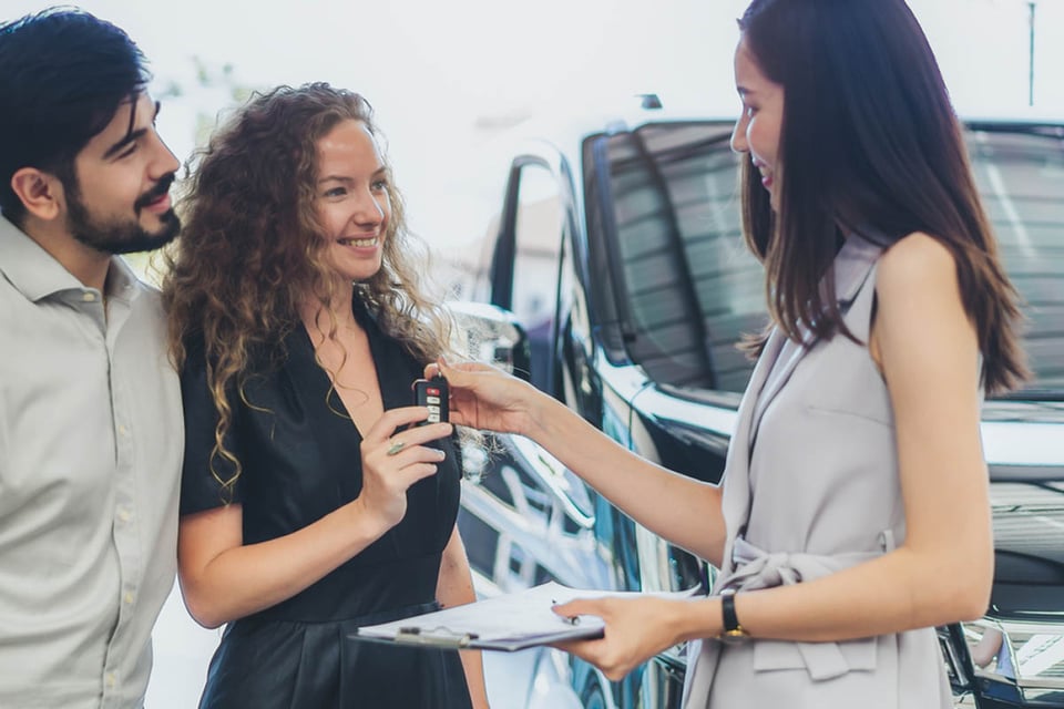 shopping for a vehicle, couple, saleswoman
