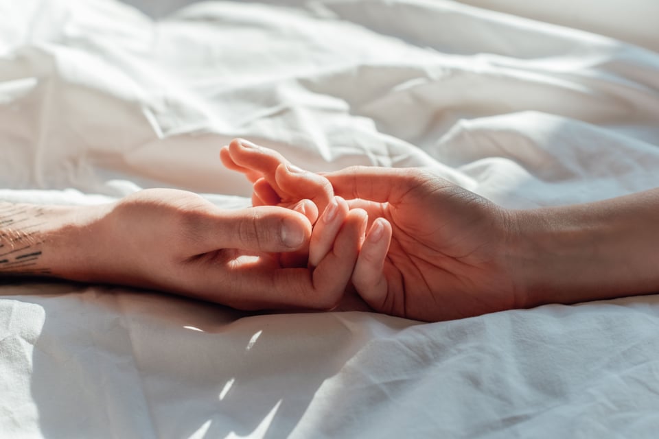 Hands of couple after orgasm