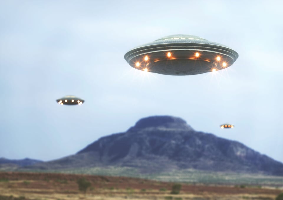 UFOs flying near a mountain