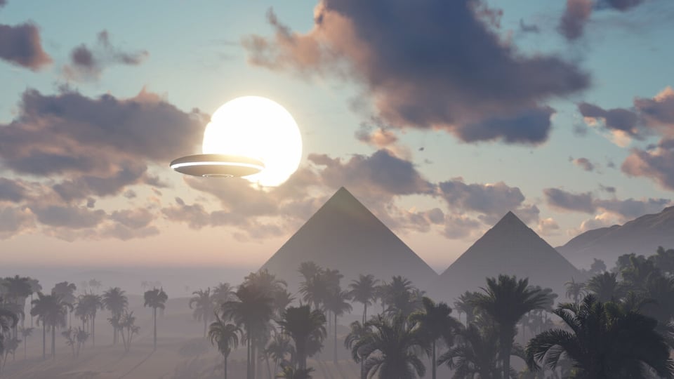 UFO flying near pyramids