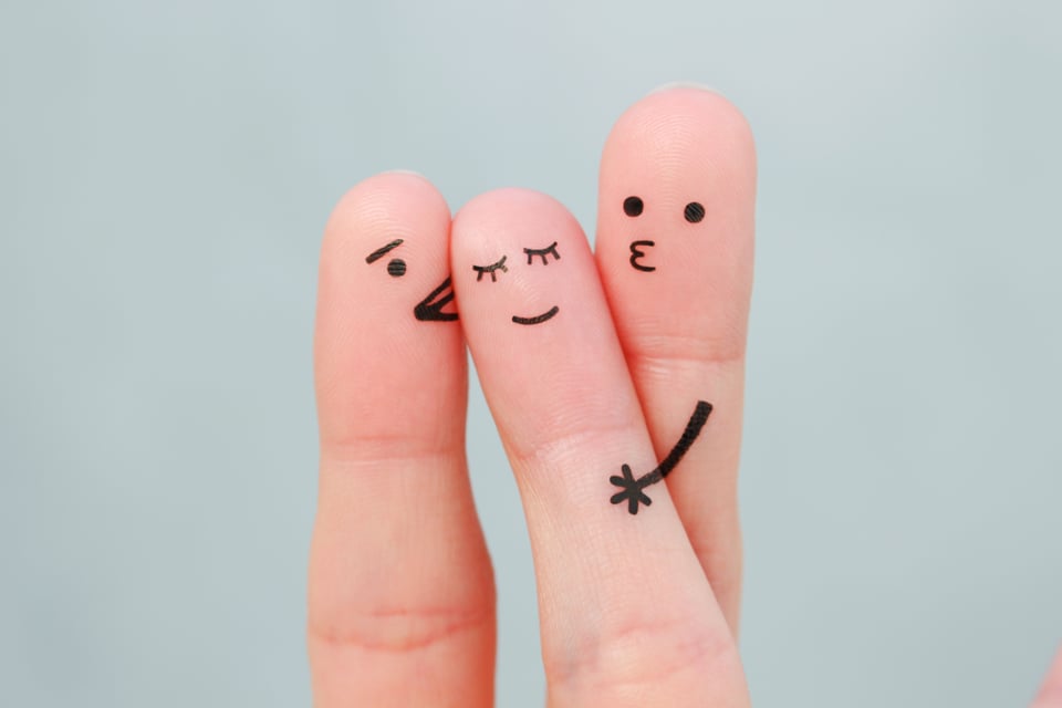 Fingers with faces as a sign of threesome