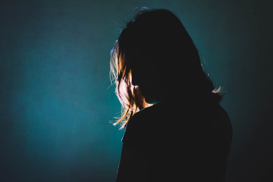 Silhouette of woman victim of domestic violence