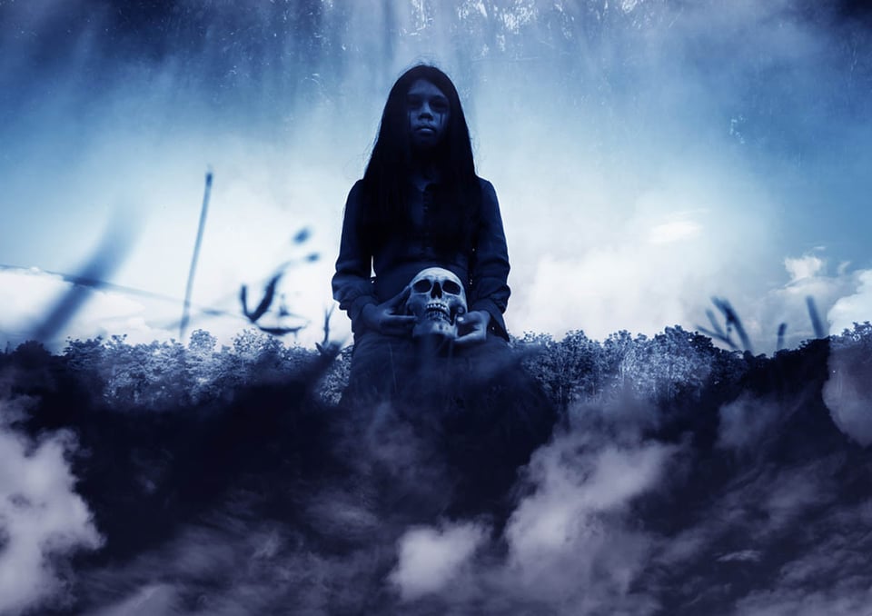 Ghost girl with human skull 