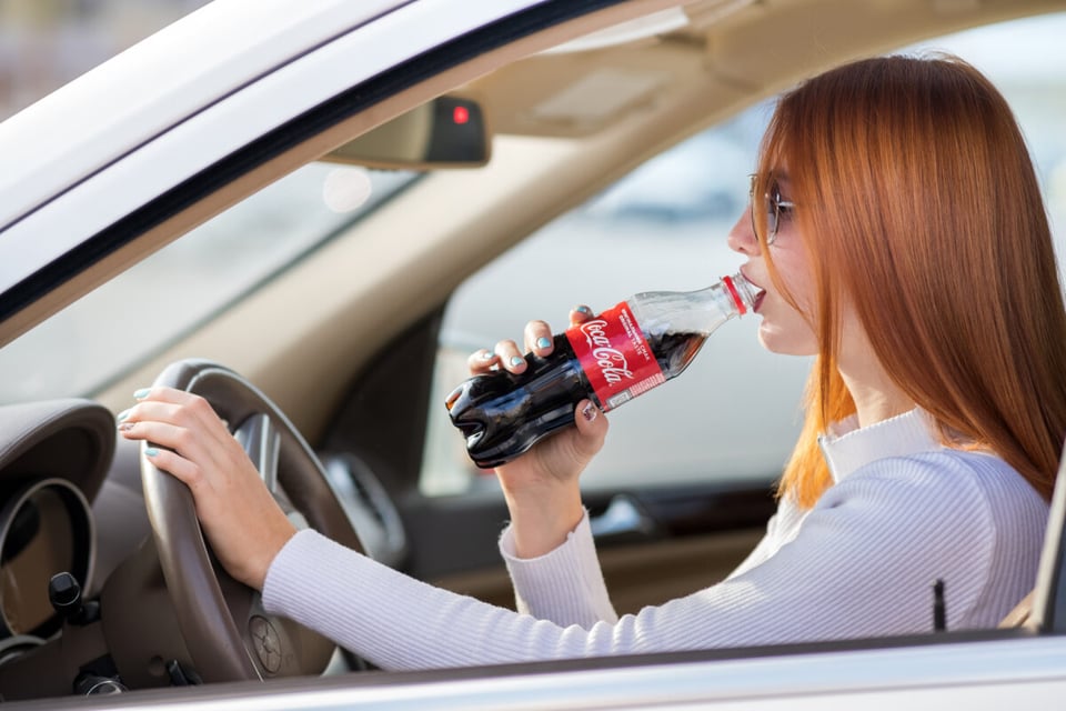 woman drinking Coca Cola, Coca Cola bottle, non-returnable, car, driving