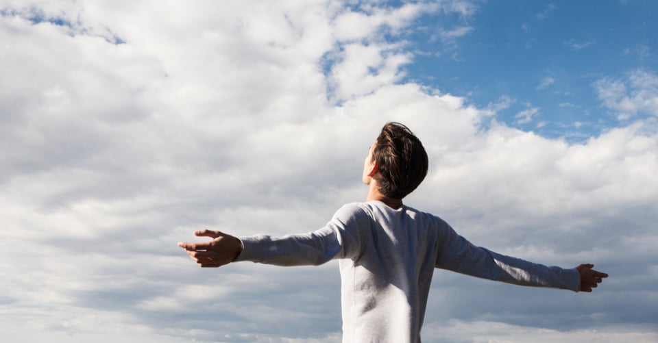 Boy with open arms as an idea to eliminate anxiety