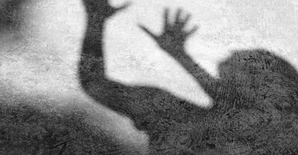 The shadow of a woman before being attacked by a murderer