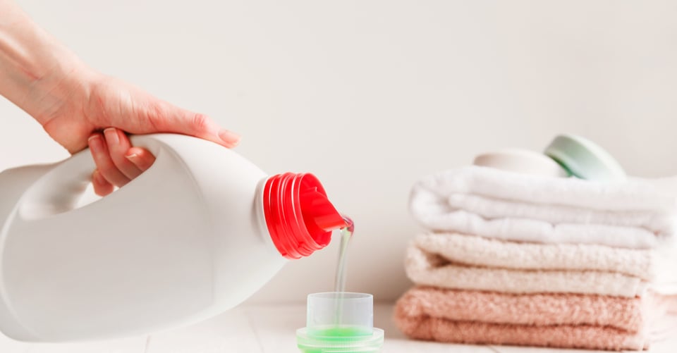 A liquid for clothes that is in a glass